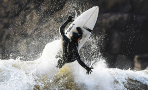 Surfer in a warm Billabong wetsuit