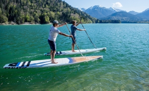 Two men paddle boarding