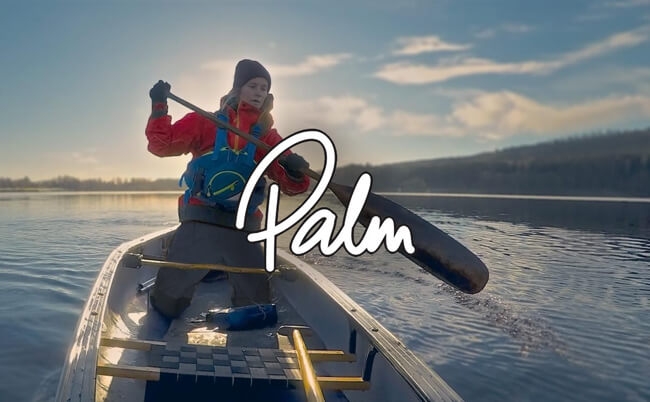 A female kayaker wearing Palm gear